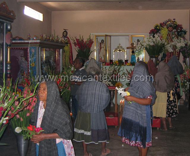 Tetelcingo_g.JPG - Inside the chapel. Women wearing  rebosos and traditional peasant clothing